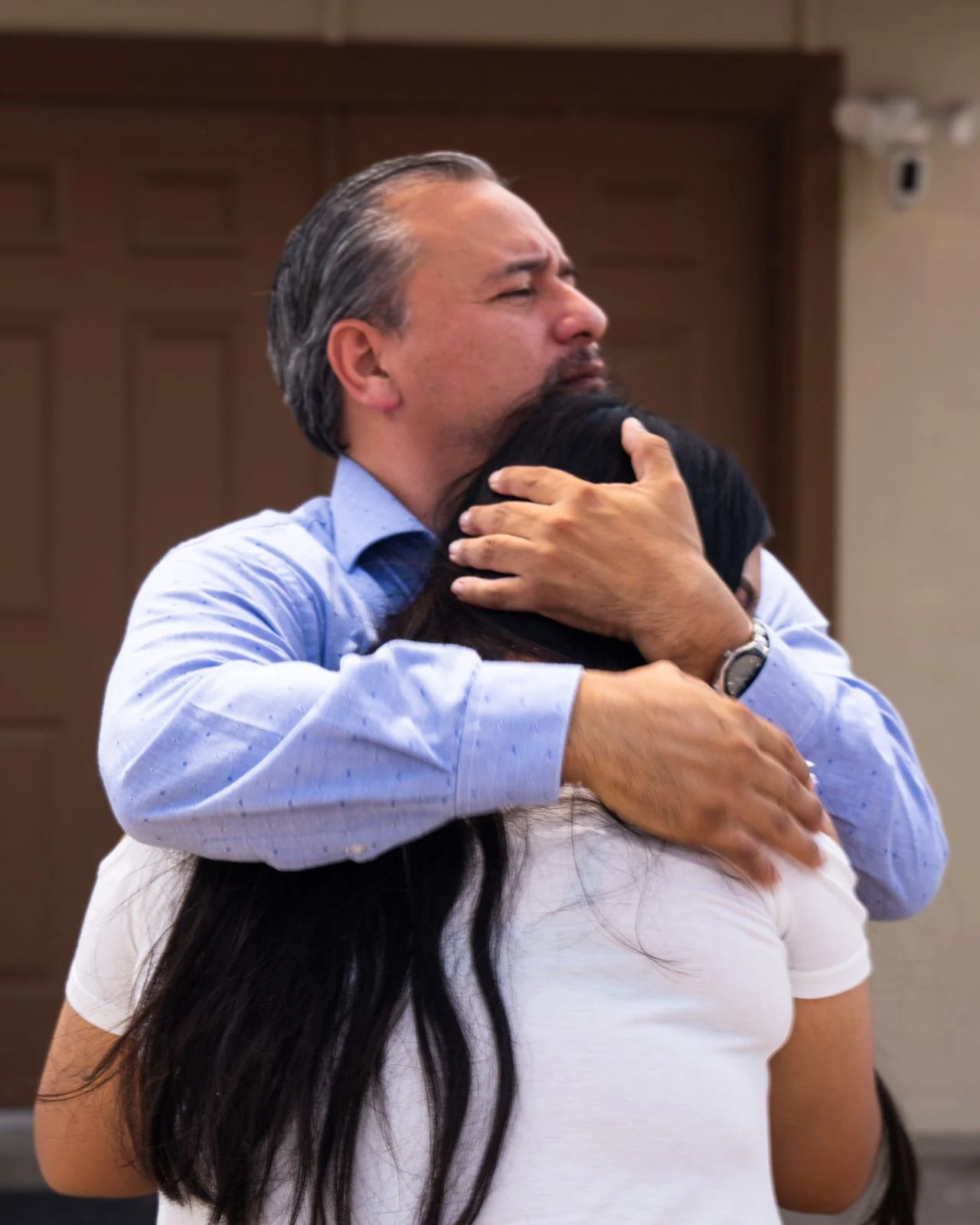 Family embracing at memorial gathering